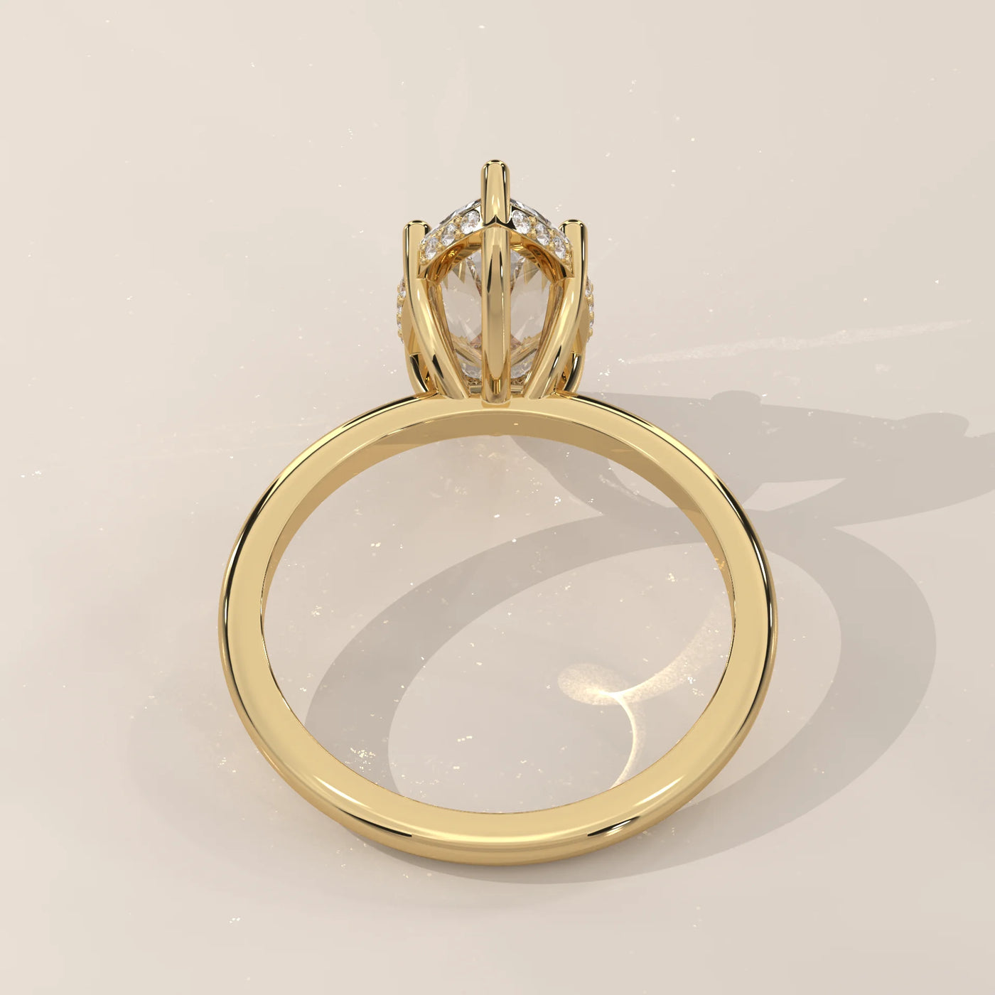 Gold ring with a prominent, clear gemstone and surrounding smaller stones.
