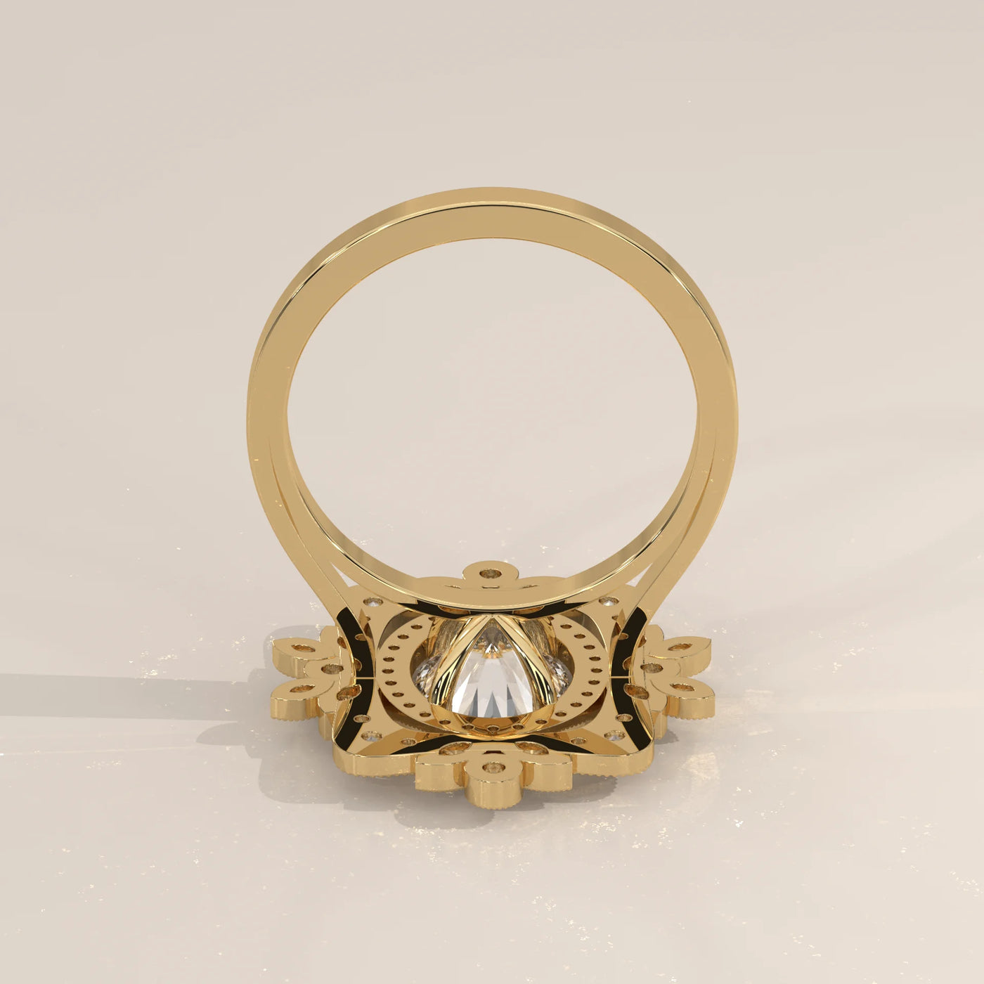 A gold ring with a large central diamond, viewed from the back.