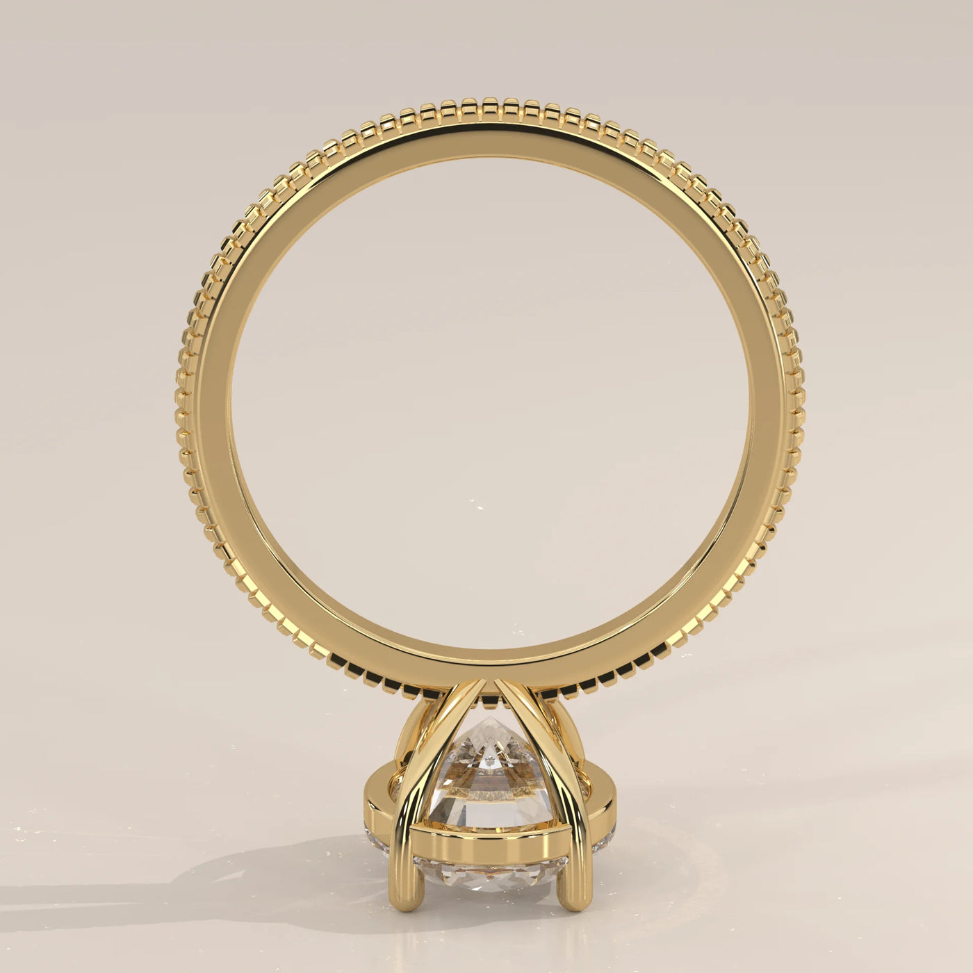 A classic solitaire diamond ring in 14k yellow gold with pavé band details.