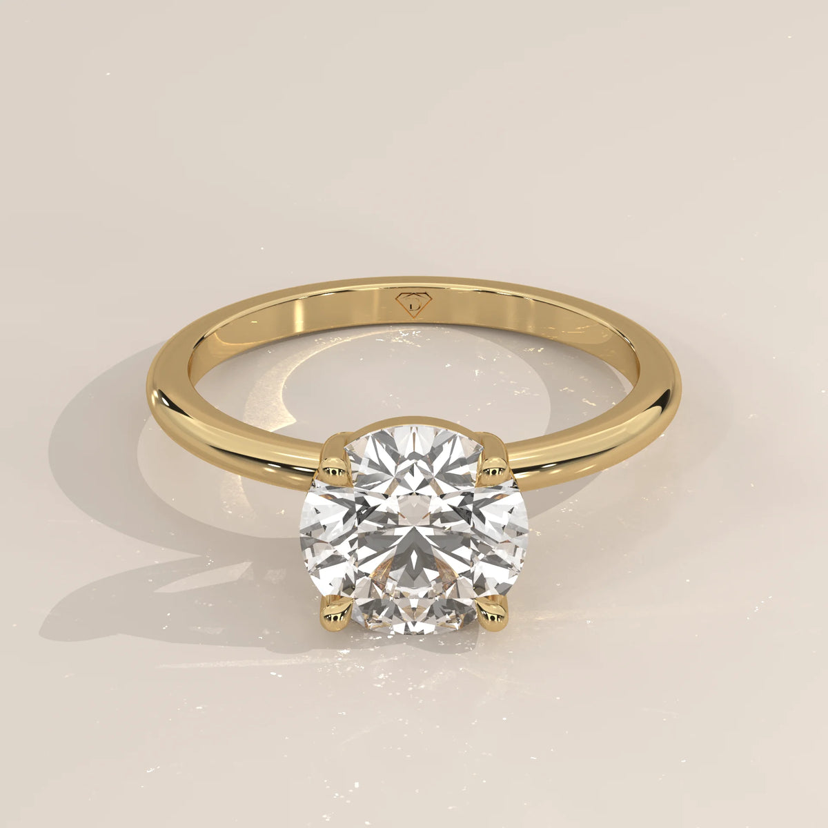 Classic solitaire diamond engagement ring in yellow gold.