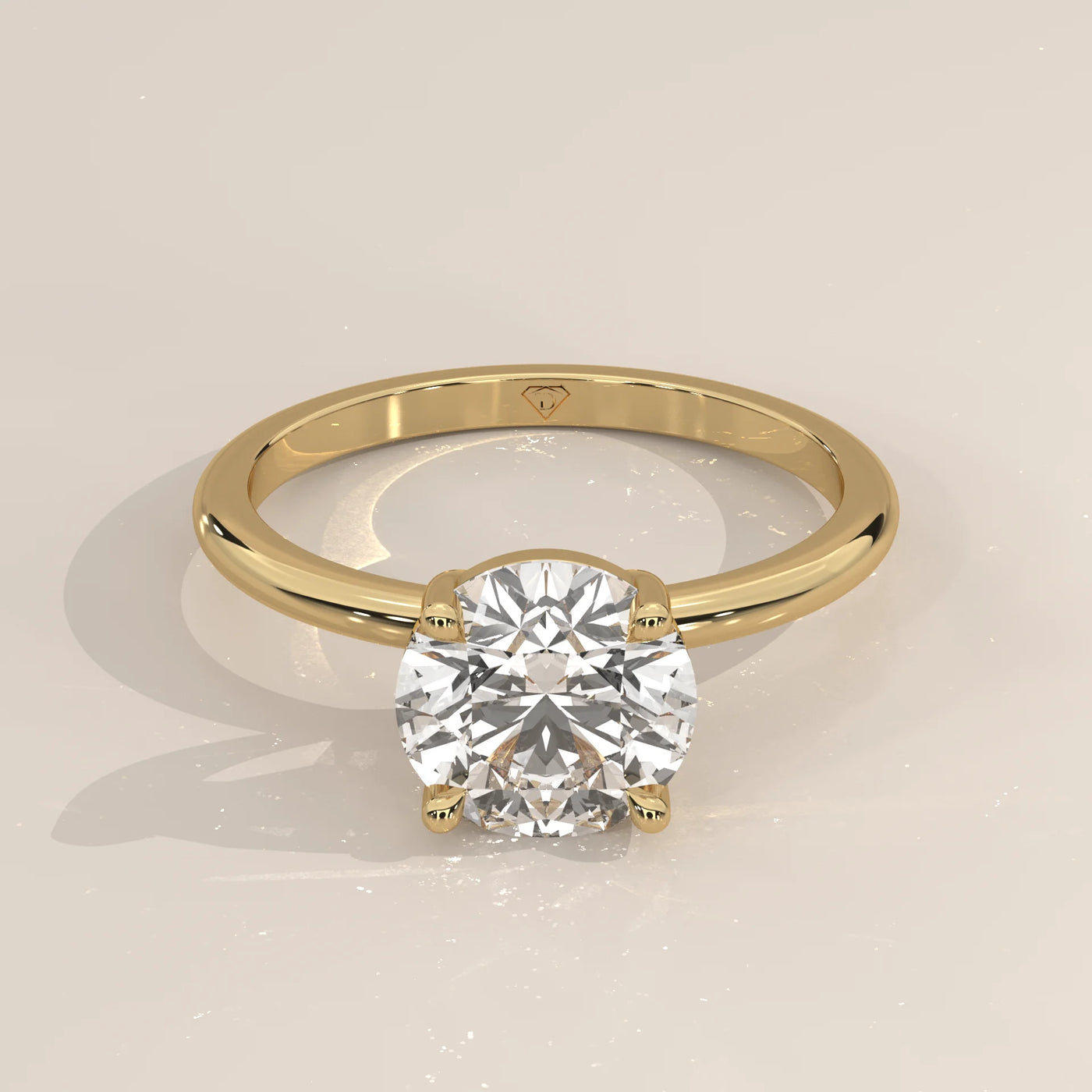Classic solitaire diamond engagement ring in yellow gold.