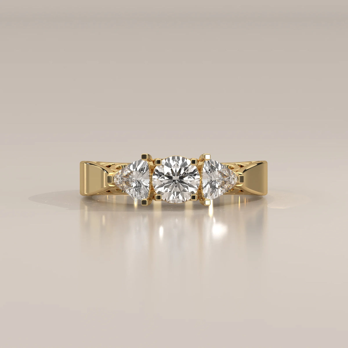 Round and Trillion Lab Grown Diamond Three Stone Filigree Ring in yellow gold, photographed head-on.