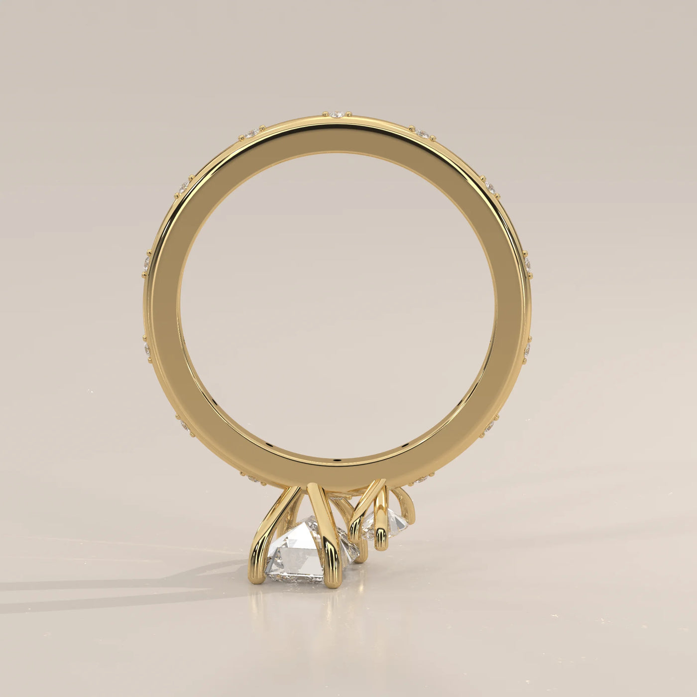 Gold ring with three diamonds and pave band.