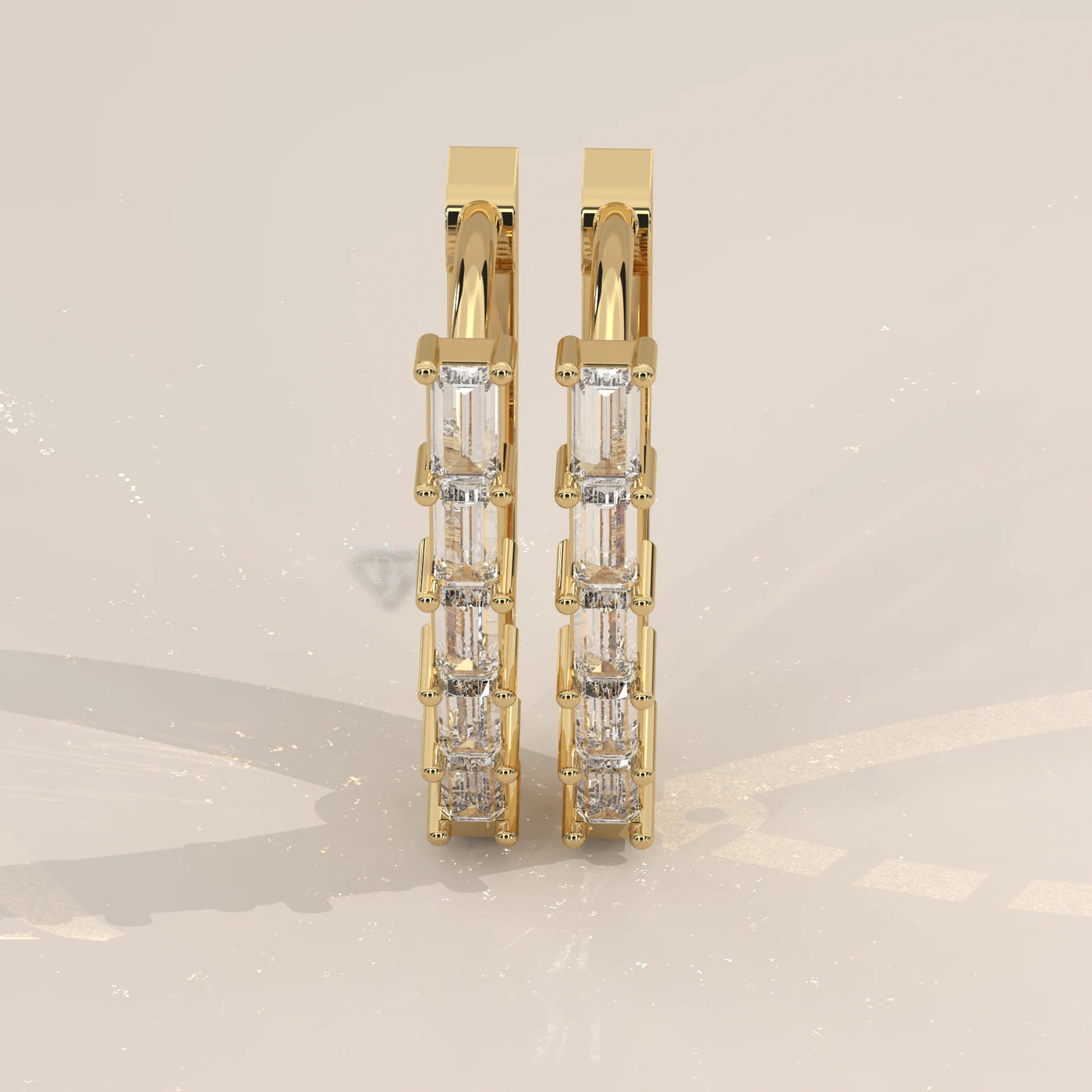 Pair Front View: Baguette Diamond Huggie Hoop Earrings with Prong Setting in Yellow Gold – Lab Grown – Driona Jewels