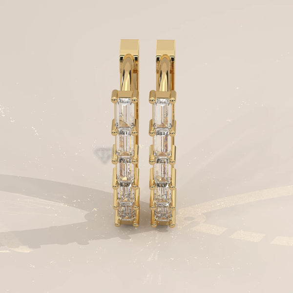Pair Front View: Baguette Diamond Huggie Hoop Earrings with Prong Setting in Yellow Gold – Lab Grown – Driona Jewels