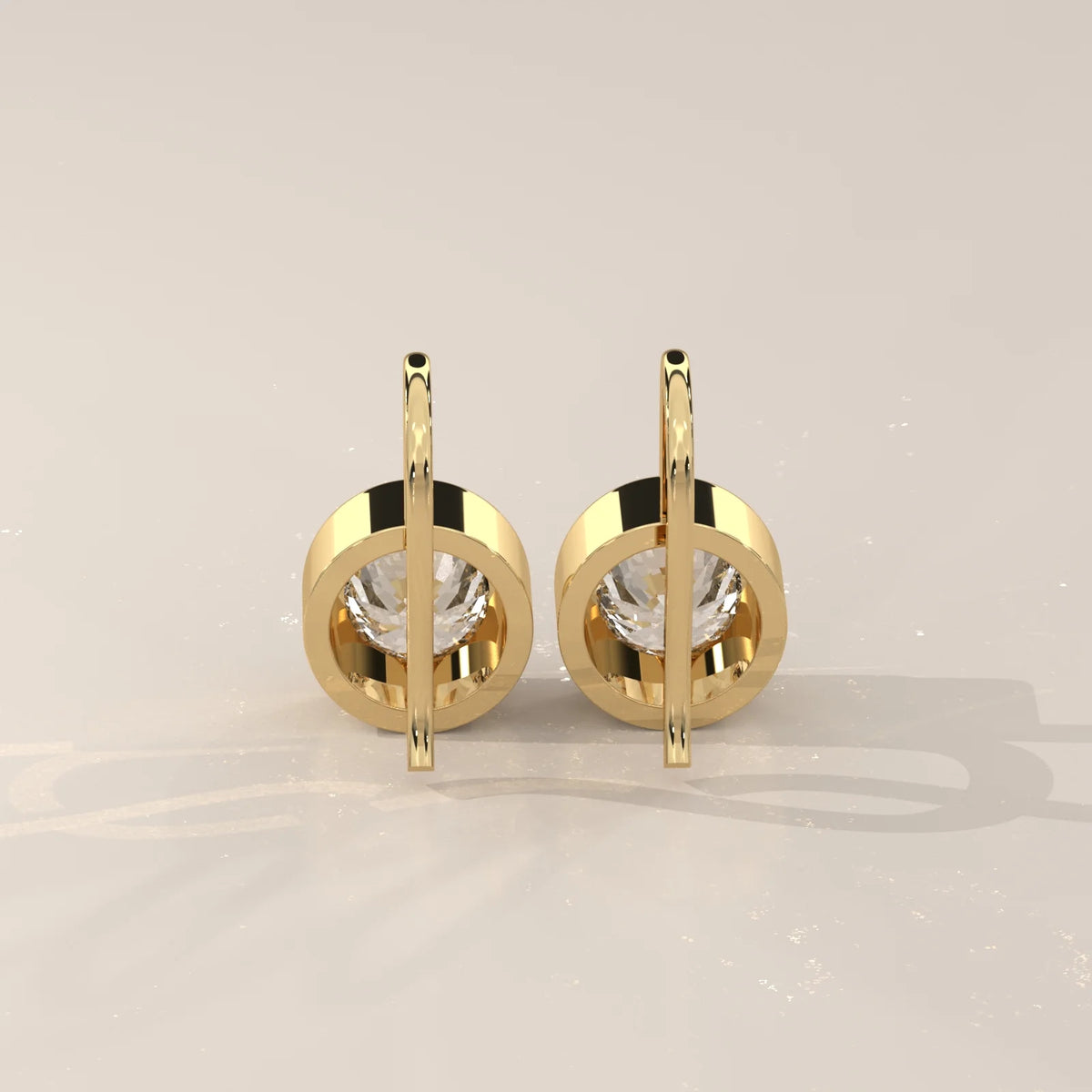 Round Bezel Set Lab Grown Diamond Drop Earrings on Gold Hook Wire in yellow gold, photographed head-on.