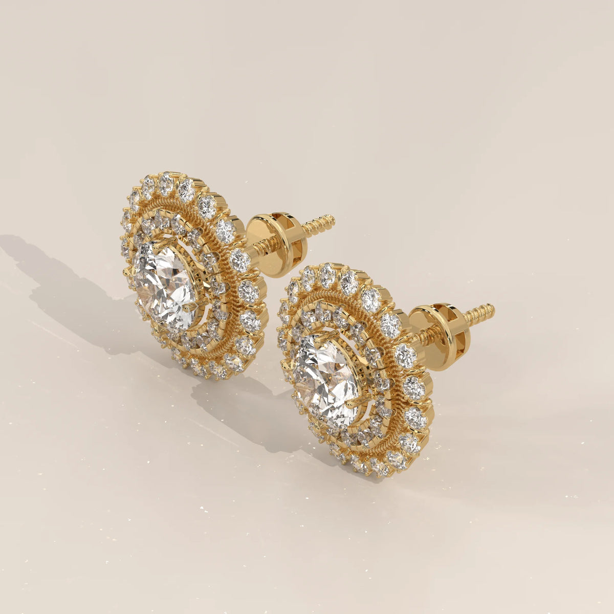 Round Double Halo Lab Grown Diamond Studs with Milgrain Divider in yellow gold, shown at an angle.