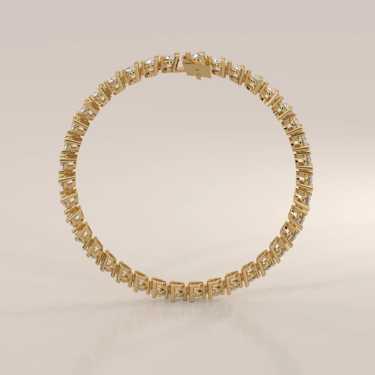 Round Lab Grown Diamond Tennis Bracelet in Three Prong Settings in yellow gold, studio photograph on a plain background.