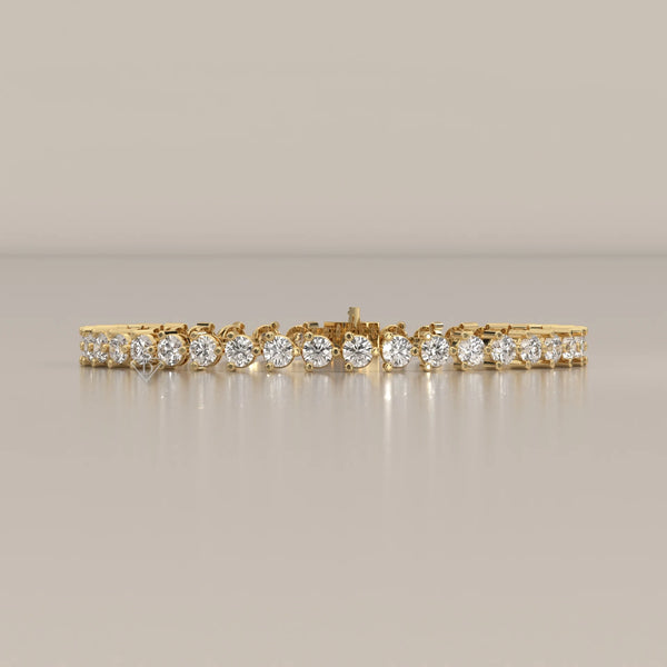 Round Lab Grown Diamond Tennis Bracelet in Three Prong Settings in yellow gold, shown from the front.