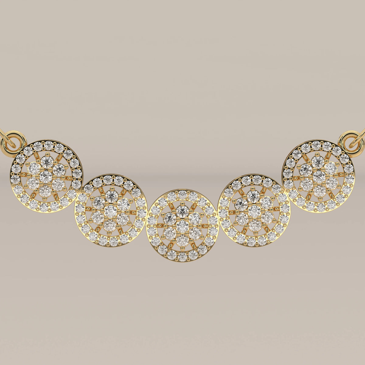 A five interlocking circles lab grown diamond necklace in yellow gold, viewed from overhead.
