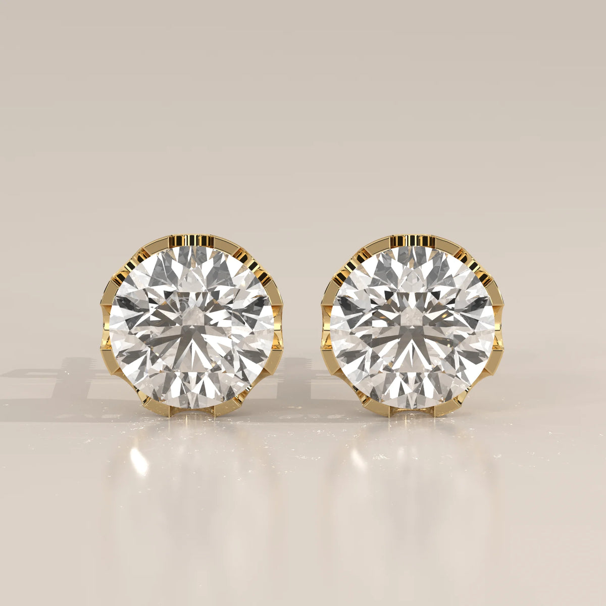 Round Solitaire Lab Grown Diamond Studs in a Crown Setting in yellow gold, shown from the front.
