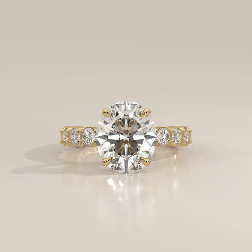 Scyrlet 5 Carat Oval Lab Grown Diamond Ring, Bold Round Diamond Band in yellow gold, photographed head-on.
