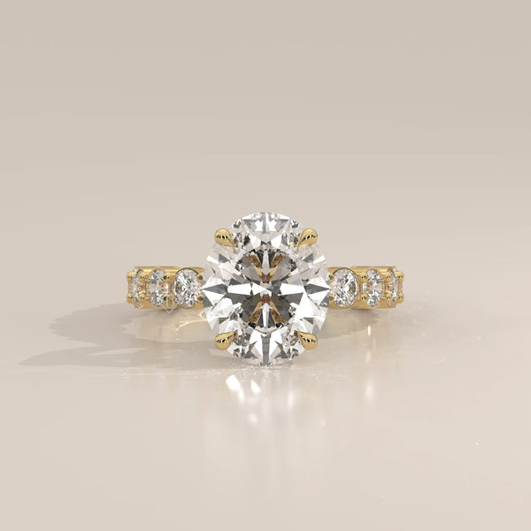 Scyrlet 5 Carat Oval Lab Grown Diamond Ring, Bold Round Diamond Band in yellow gold, photographed head-on.