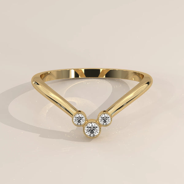 Sharp V Chevron Ring with a Three Diamond Bezel Cluster in yellow gold, shown from the front.