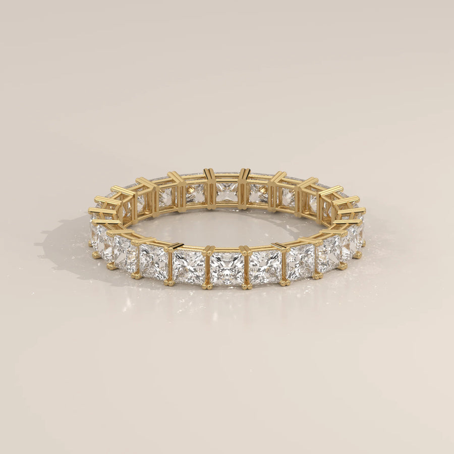 Slim Princess Cut Diamond Full Eternity Wedding Band in Gold in yellow gold, shown on a plain background.