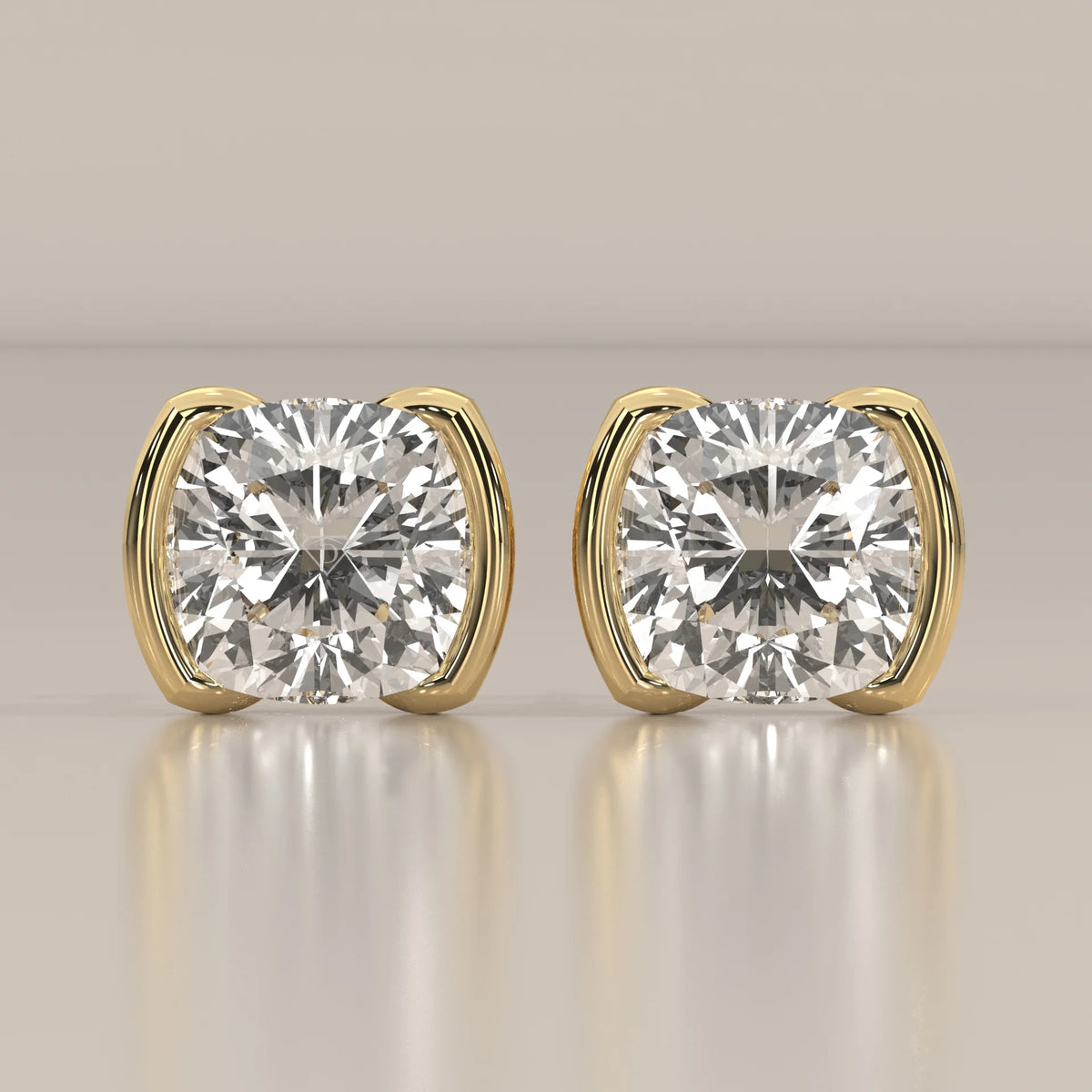 Square Cushion Half Bezel Lab Grown Diamond Stud Earrings in yellow gold, shown from the front.