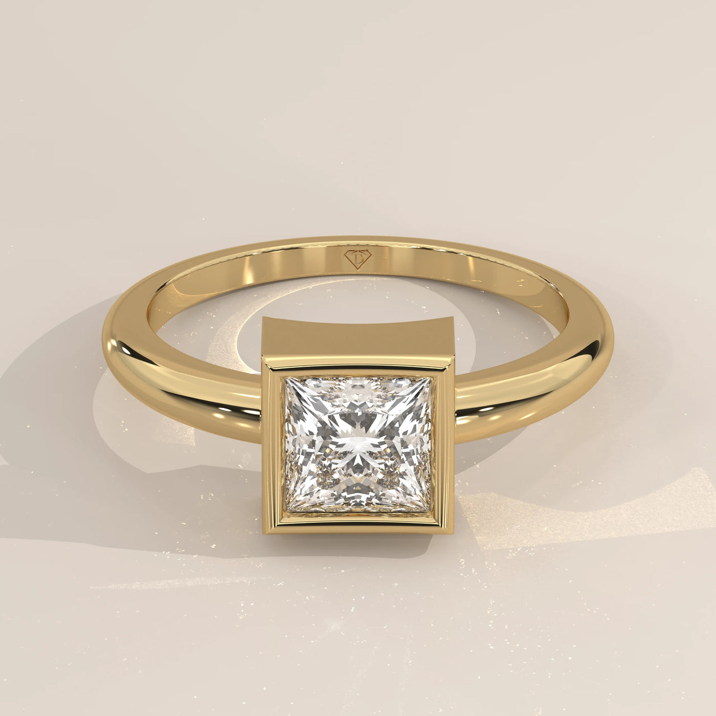 A polished gold ring with a square princess-cut diamond in a bezel setting.