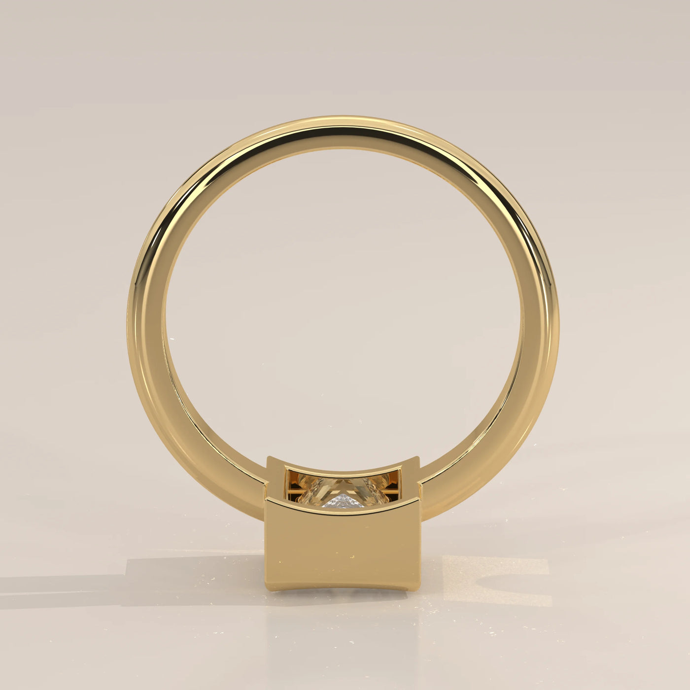 A minimalist 14k yellow gold ring with a square-cut diamond.