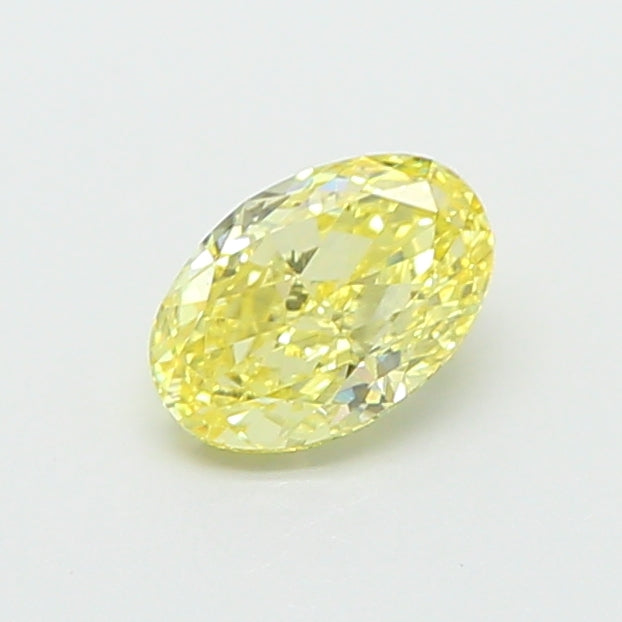 0.65 carat fancy intense yellow oval lab grown diamond VS1 clarity
