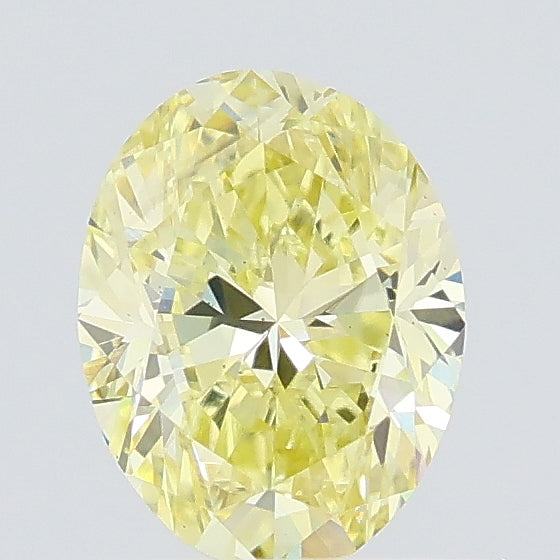 0.69 carat fancy intense yellow oval lab grown diamond VS1 clarity