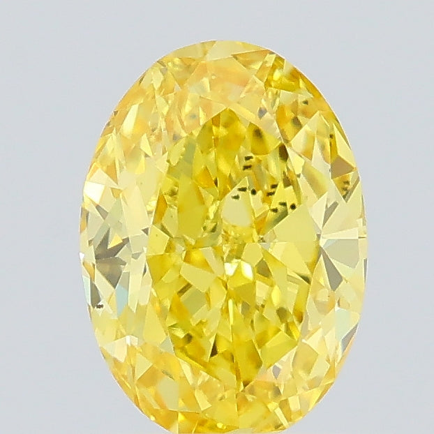 0.61 carat fancy vivid yellow oval lab grown diamond VS2 clarity