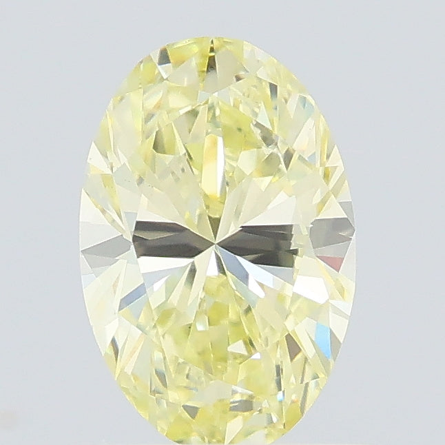 0.68 carat fancy light yellow oval lab grown diamond VS1 clarity