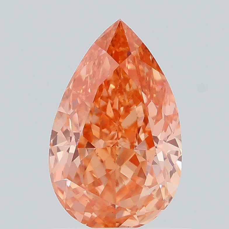 0.94 carat fancy vivid orangey pink pear lab grown diamond VS1 clarity