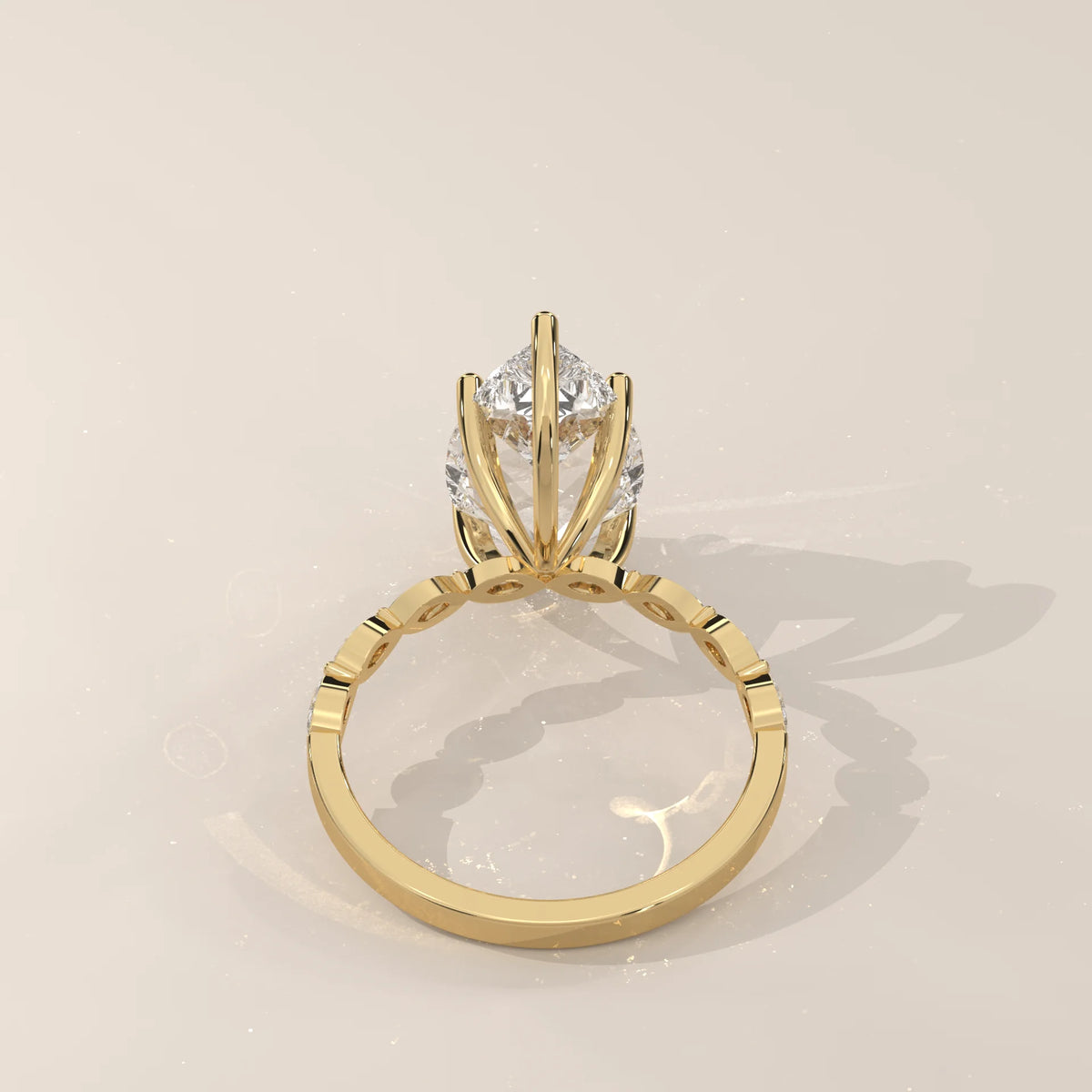Stlea 5 Carat Pear Lab Grown Diamond Ring, Bezel Marquise Band in yellow gold, shown on a plain background.