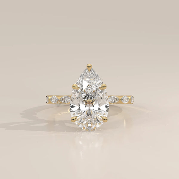 Stlea 5 Carat Pear Lab Grown Diamond Ring, Bezel Marquise Band in yellow gold, photographed head-on.