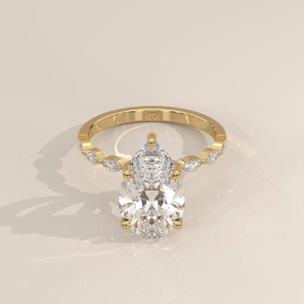 Stlea 5 Carat Pear Lab Grown Diamond Ring, Bezel Marquise Band in yellow gold, shown from the front.