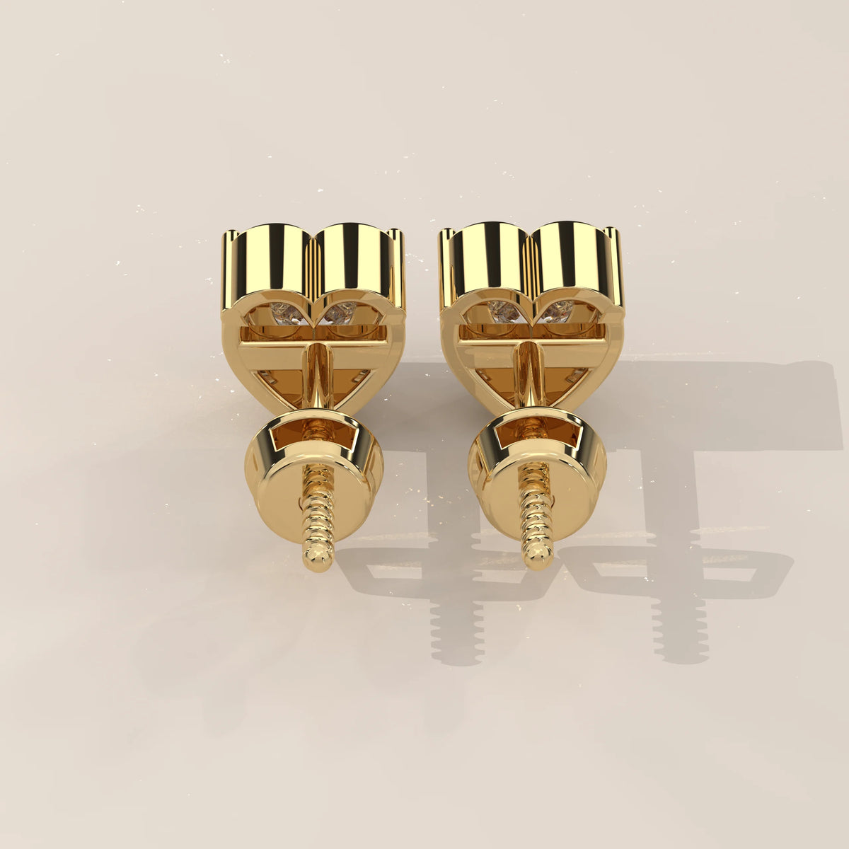 Pair of 14k yellow gold stud earrings with diamonds, shown from the back.