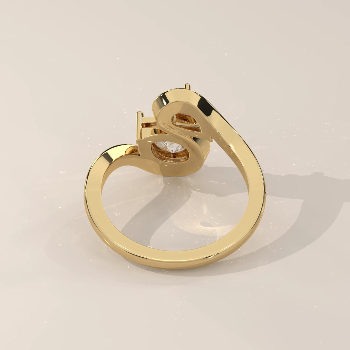 A gold bypass ring with a single diamond, shown from the side.