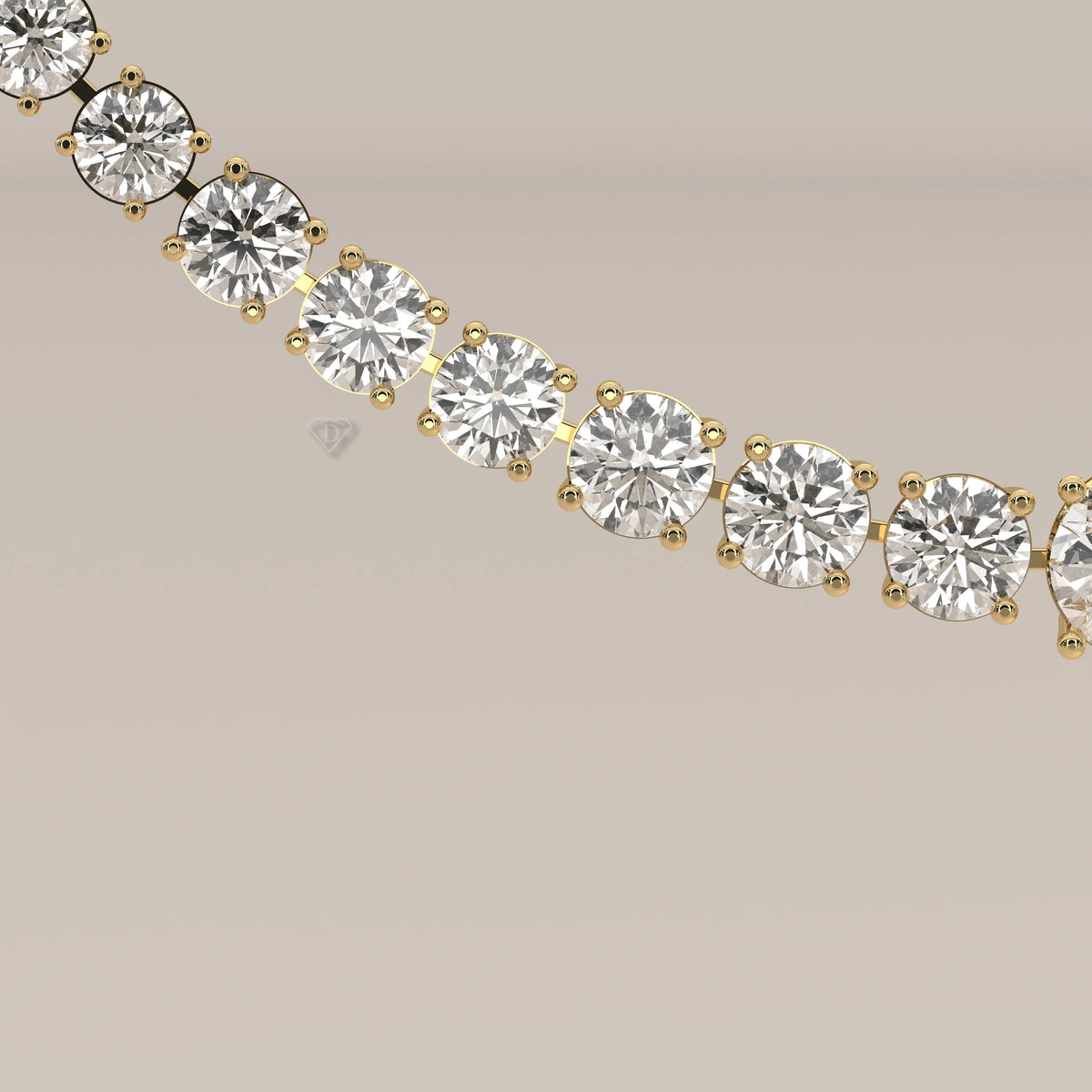 A graduated round lab grown diamond tennis necklace in yellow gold, shown on a plain background.
