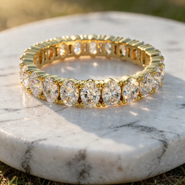 Flat Lay: Oval Diamond Tennis Bracelet with Prong Setting in 14k Yellow Gold - Lab Grown - Driona Jewels