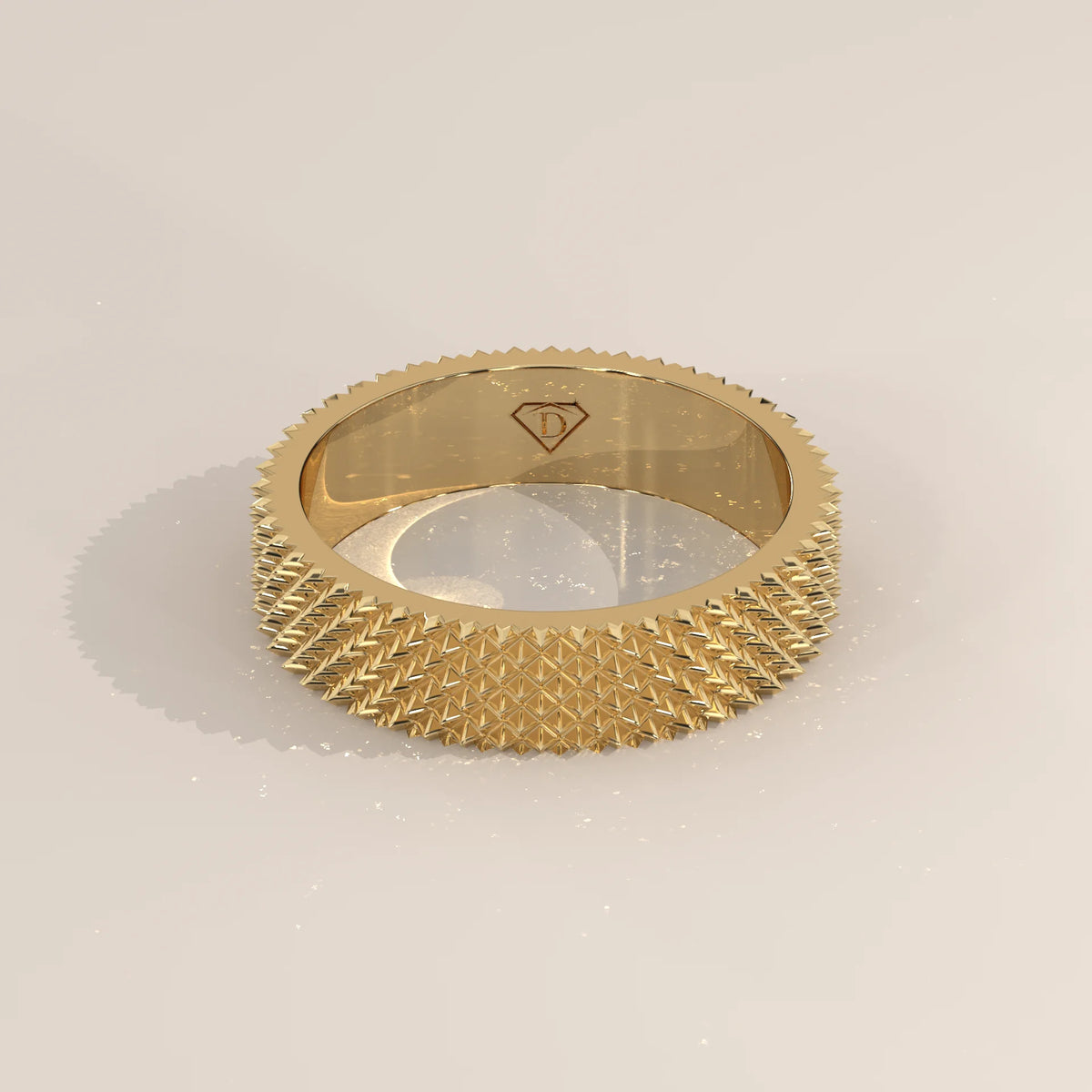Solid yellow gold wide band with an all-over pyramid texture, shown from the front.