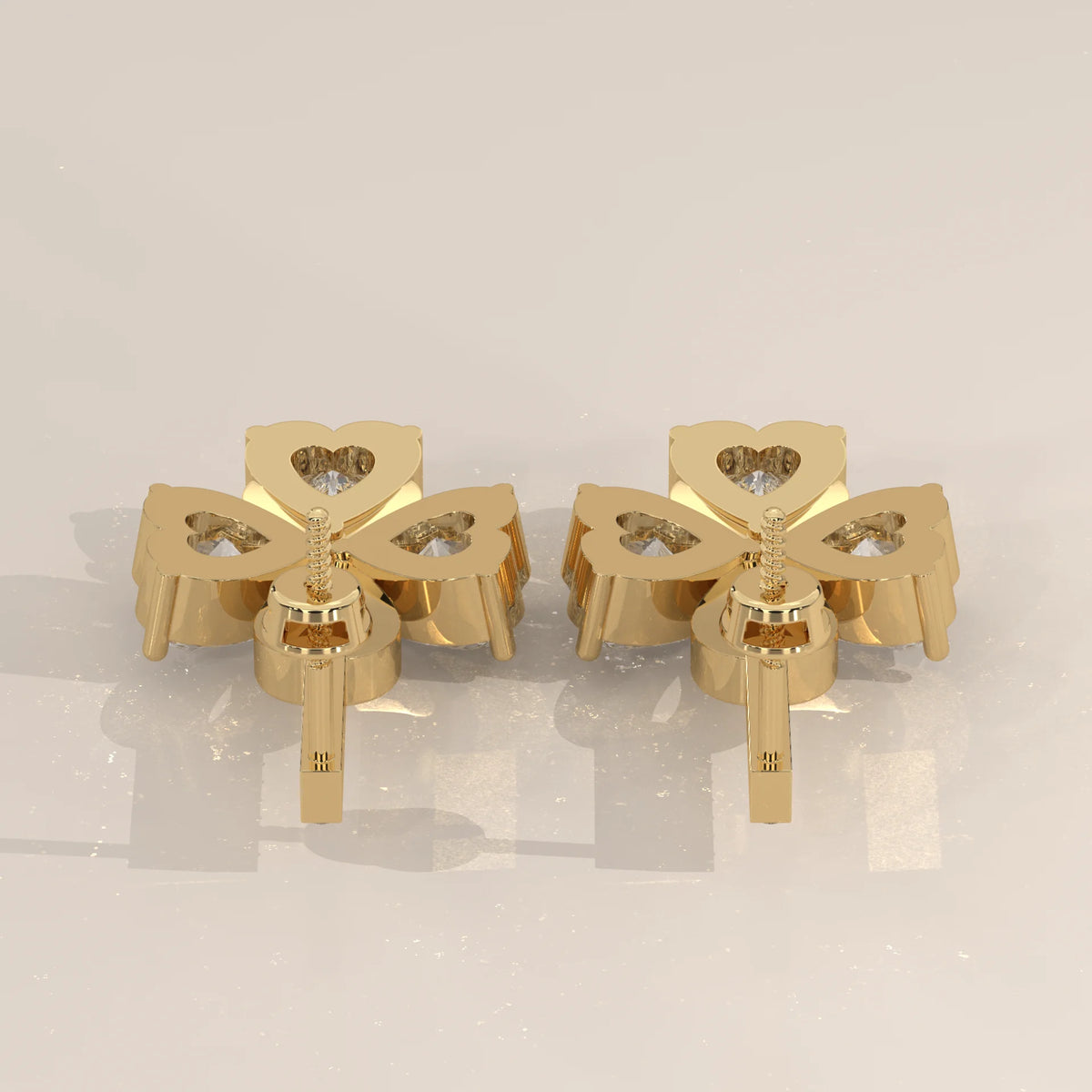 Three Heart Lab Grown Diamond Clover Drop Earrings with Pave Bar in yellow gold, product photograph on a plain background.