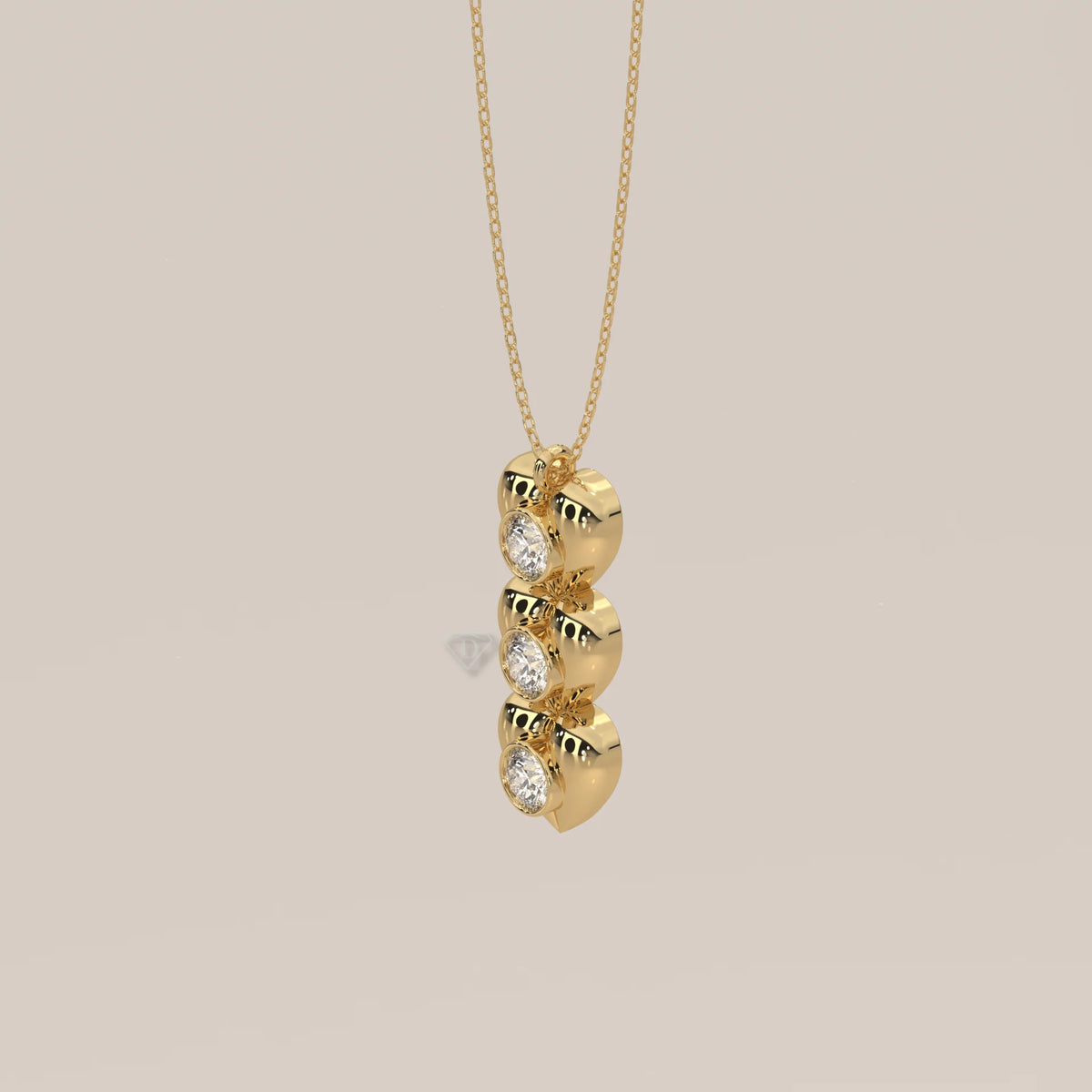 Three Puffed Heart Lab Grown Diamond Drop Pendant with Bezel Rounds in yellow gold, shown from the side.