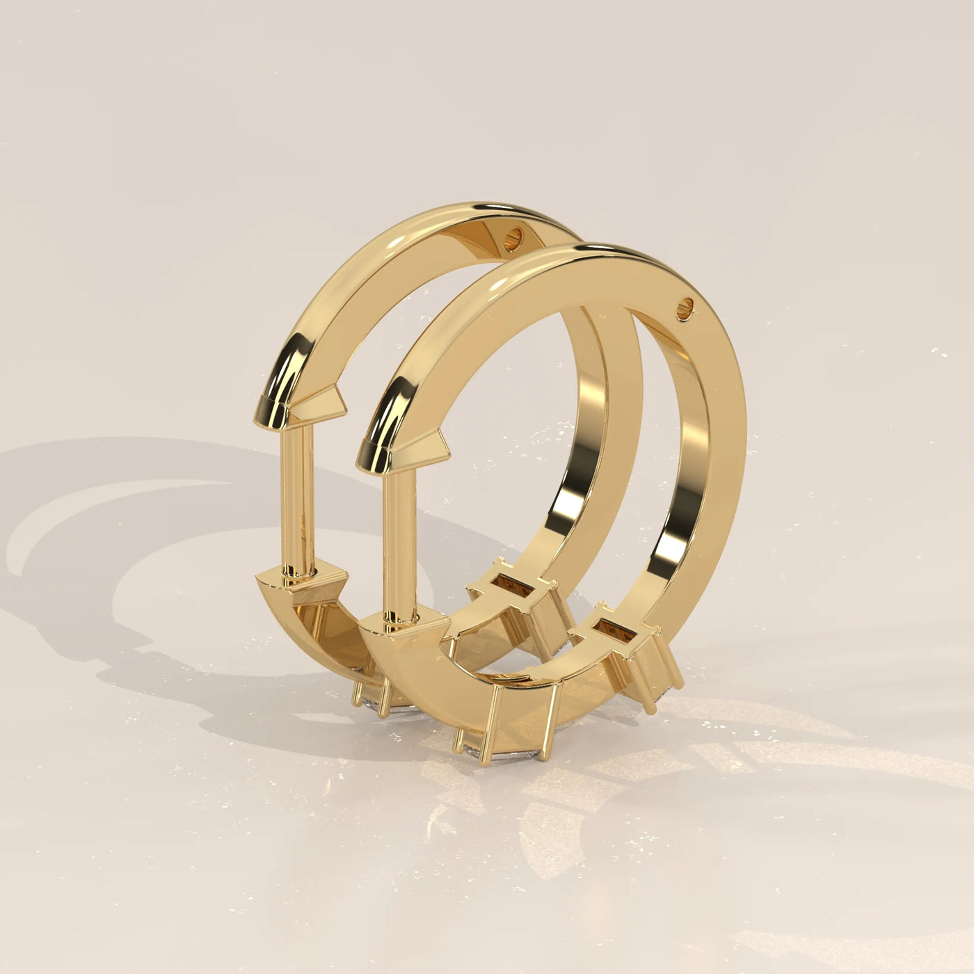Angle View: Emerald Cut Diamond Huggie Hoop Earrings with Three-Stone Setting in Yellow Gold – Lab Grown – Driona Jewels