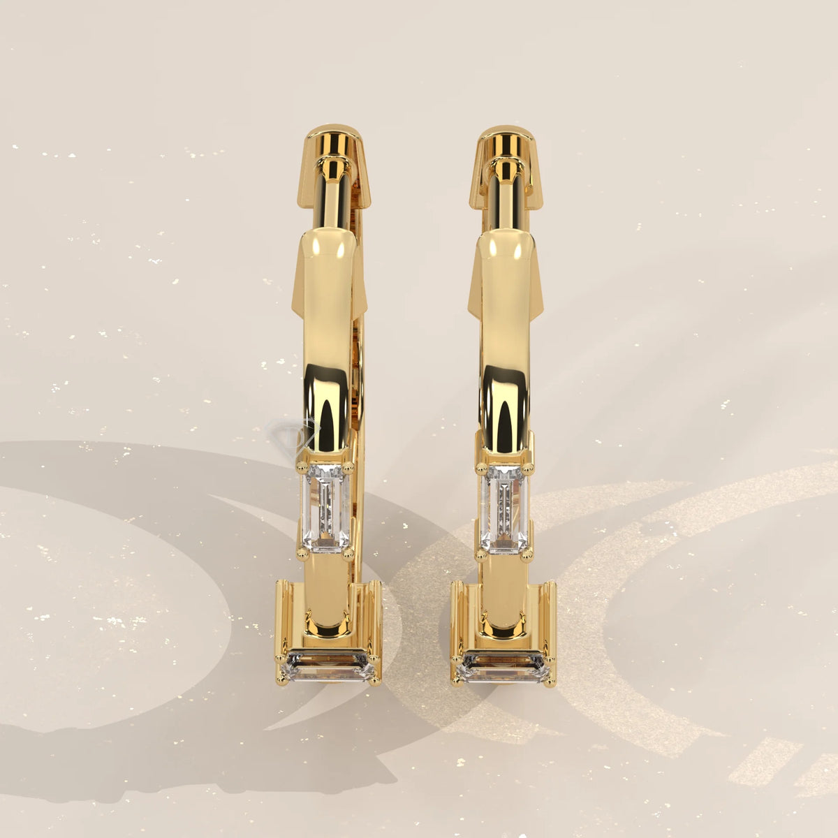 Pair Front View: Emerald Cut Diamond Huggie Hoop Earrings with Three-Stone Setting in Yellow Gold – Lab Grown – Driona Jewels
