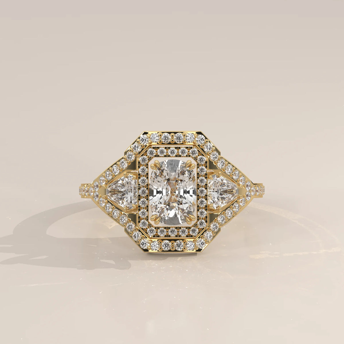 Cushion Lab Grown Diamond Art Deco Halo Ring with Shield Side Stones in yellow gold, photographed head-on.