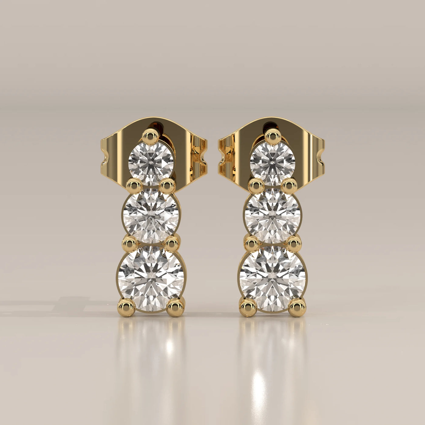 Front View: Round Diamond Stud Earrings with Three-Stone Setting in Yellow Gold – Lab Grown – Driona Jewels