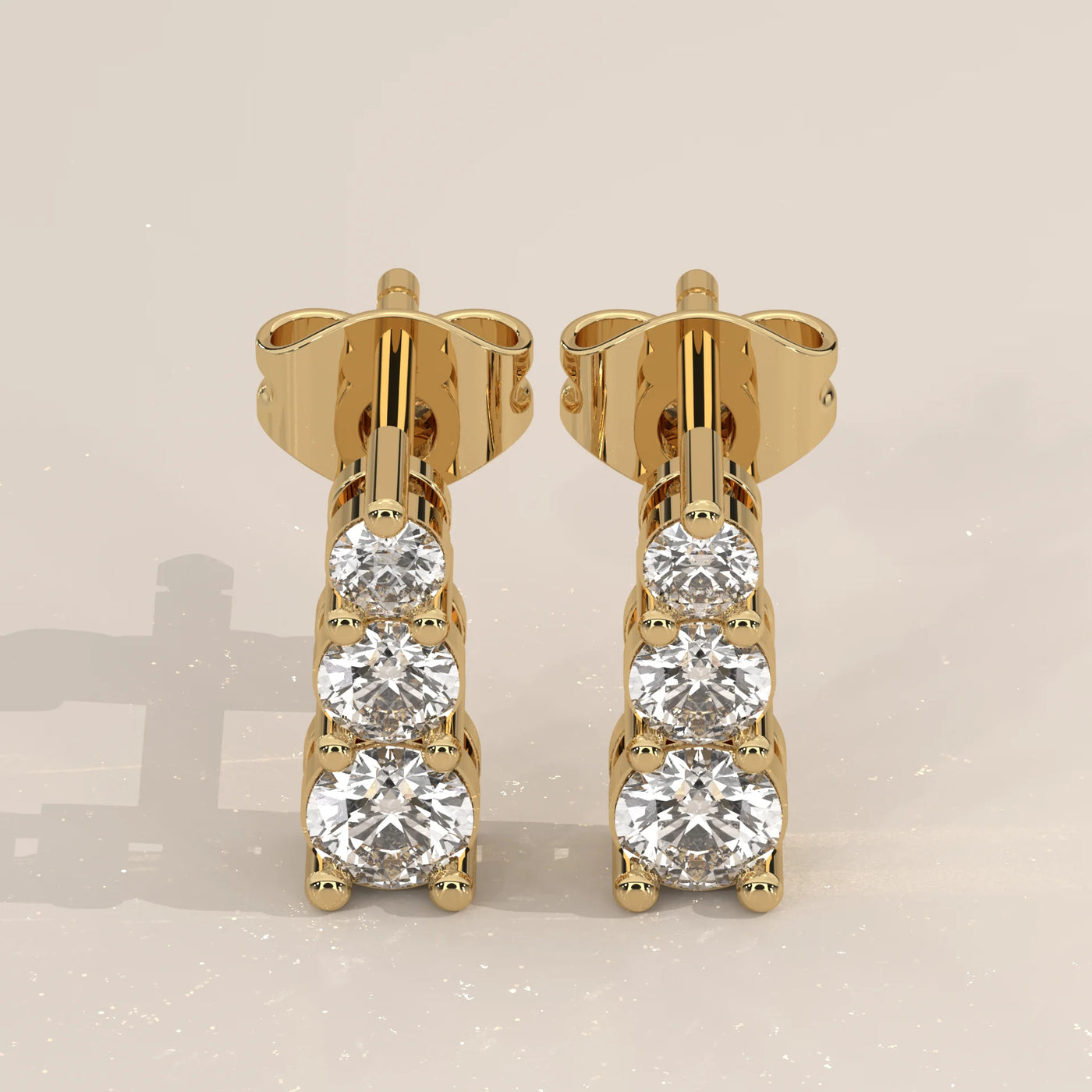Pair Front View: Round Diamond Stud Earrings with Three-Stone Setting in Yellow Gold – Lab Grown – Driona Jewels