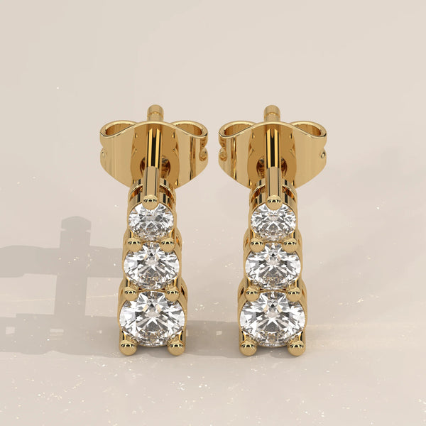 Pair Front View: Round Diamond Stud Earrings with Three-Stone Setting in Yellow Gold – Lab Grown – Driona Jewels