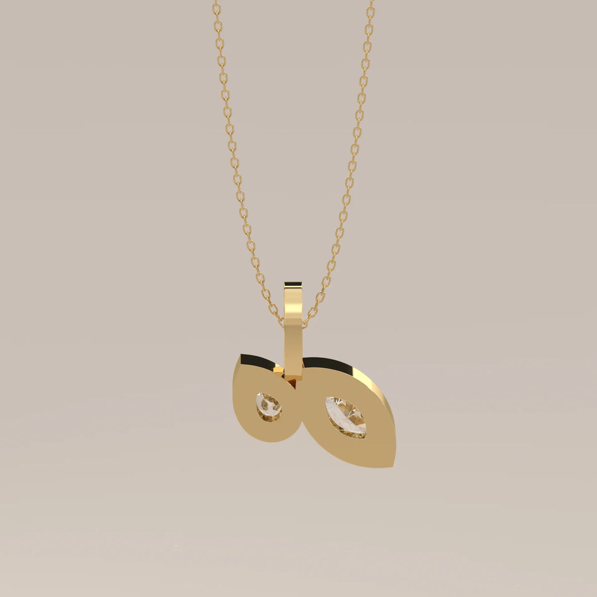 Toi et Moi Bezel Marquise and Pear Lab Grown Diamond Pendant in yellow gold, shown at an angle.