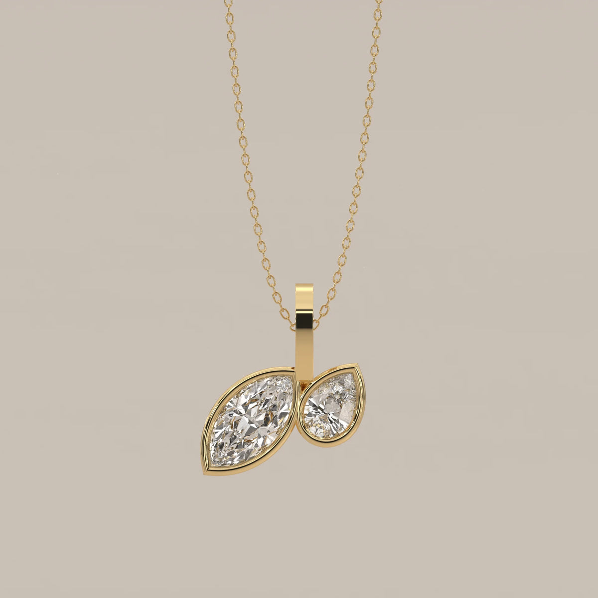 Toi et Moi Bezel Marquise and Pear Lab Grown Diamond Pendant in yellow gold, shown from the front.