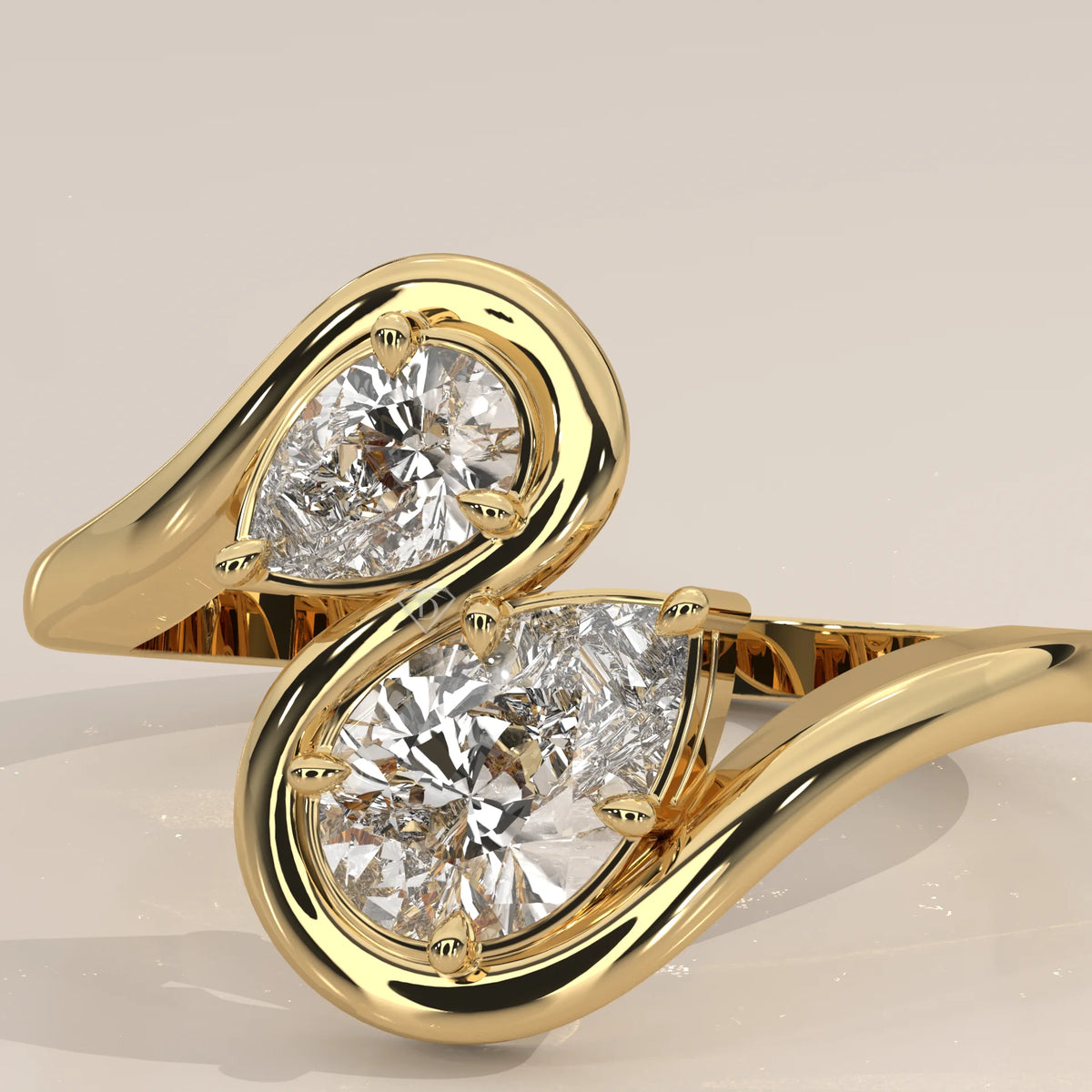 Two Pear Lab Grown Diamond Toi et Moi Ring with S Shaped Outline in yellow gold, front view on a plain background.