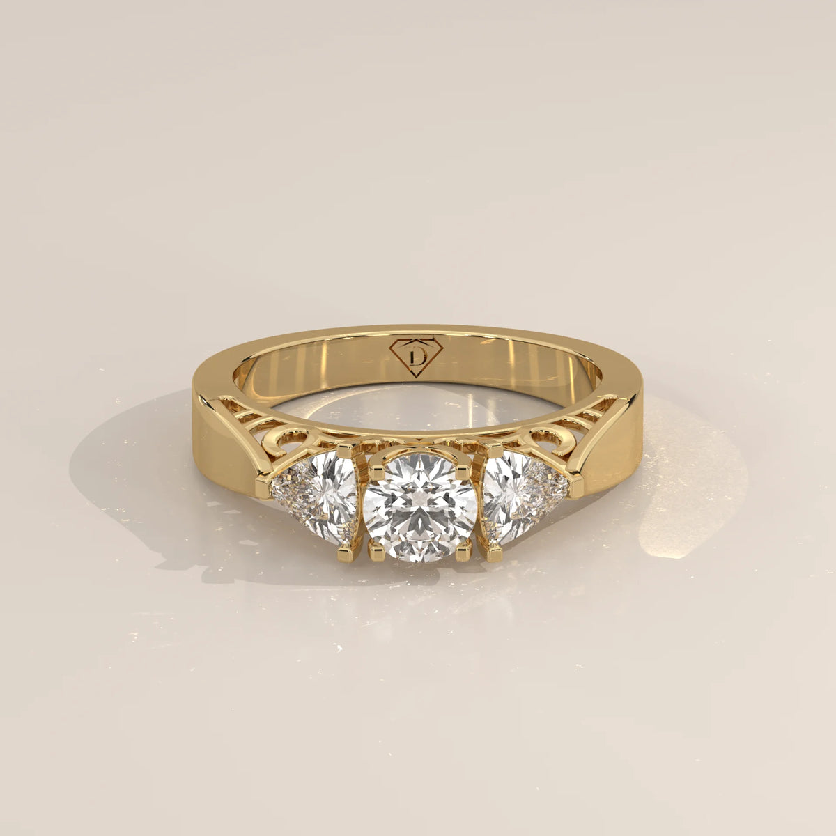 Round and Trillion Lab Grown Diamond Three Stone Filigree Ring in yellow gold, shown from the front.