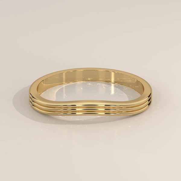 Triple Grooved Gold Band with a Soft Contour Curve, shown from the front.
