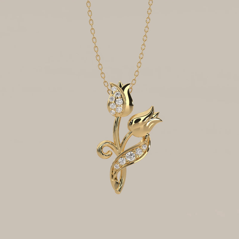 Delicate gold necklace featuring two diamond-studded tulip pendants.