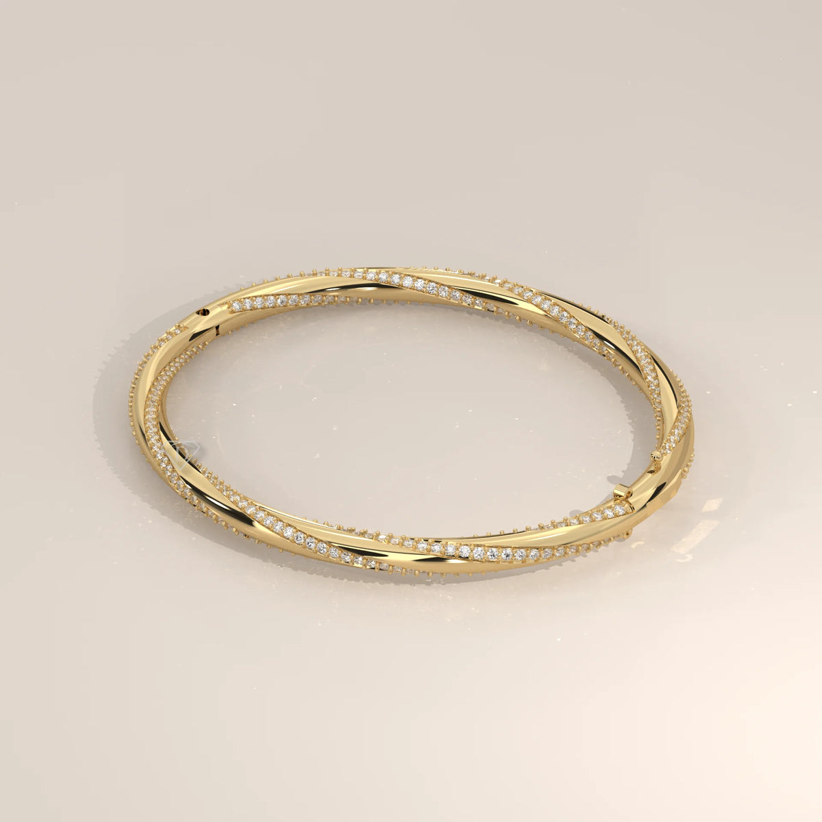 Twisted Pave Lab Grown Diamond Hinged Bangle with Polished Band in yellow gold, photographed at a three-quarter angle.